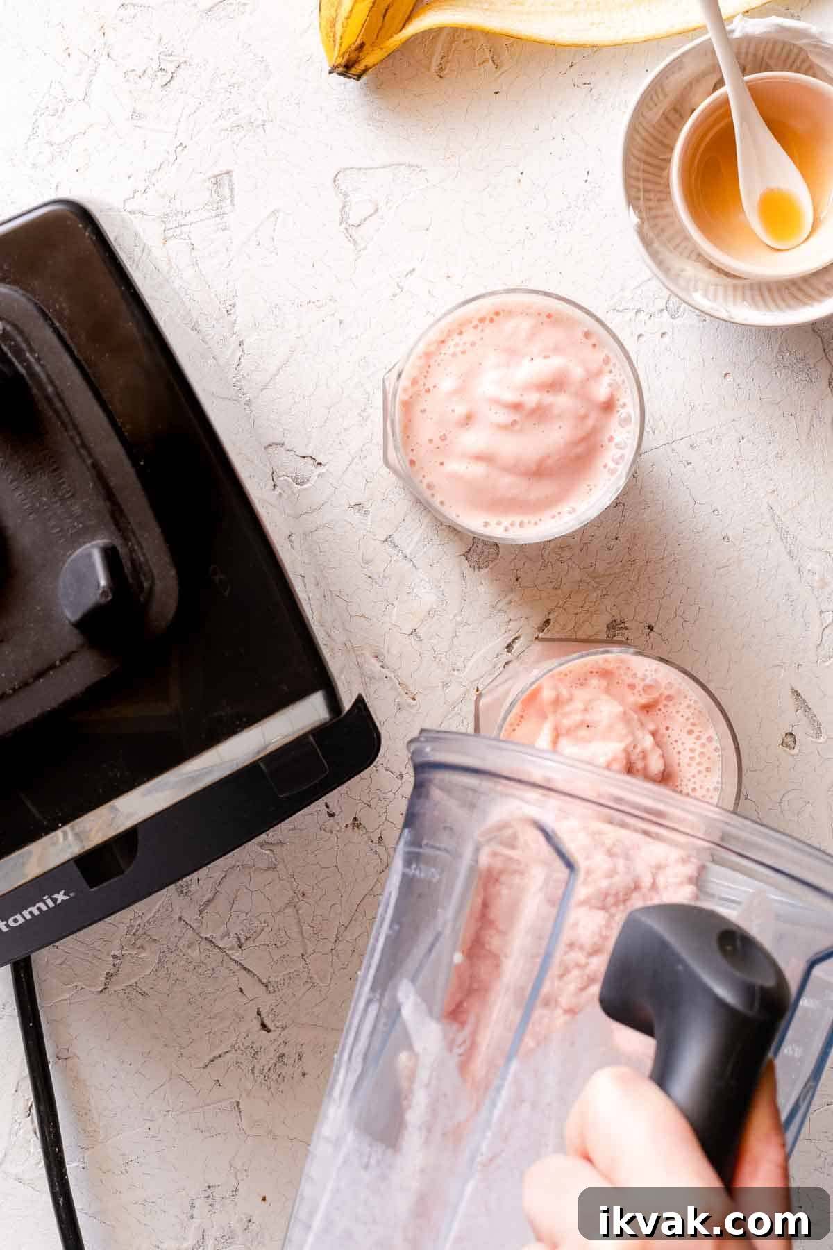 Creamy Banana and Watermelon Smoothie Recipe 8 smoothie being poured from blender into 2 glasses