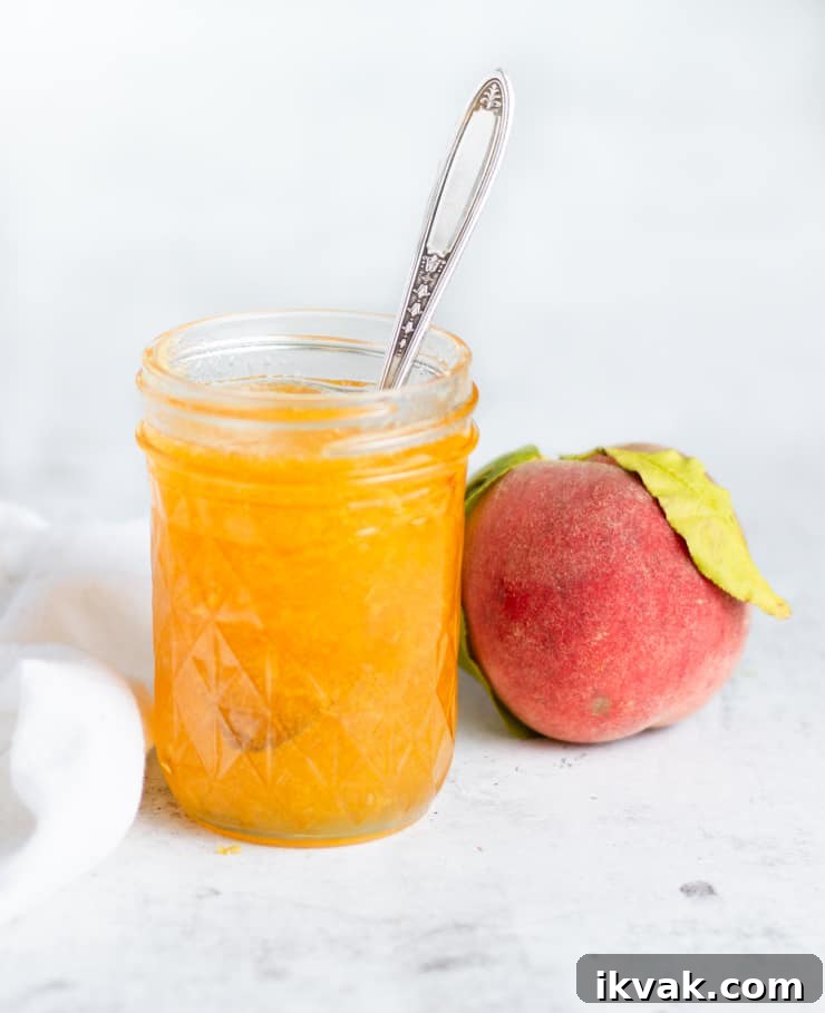 Small-Batch Bourbon Peach Jam Recipe for Preserving Summer Flavor 6 open jar of peach jam