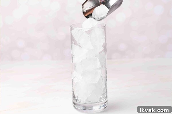 Pouring ice into a glass