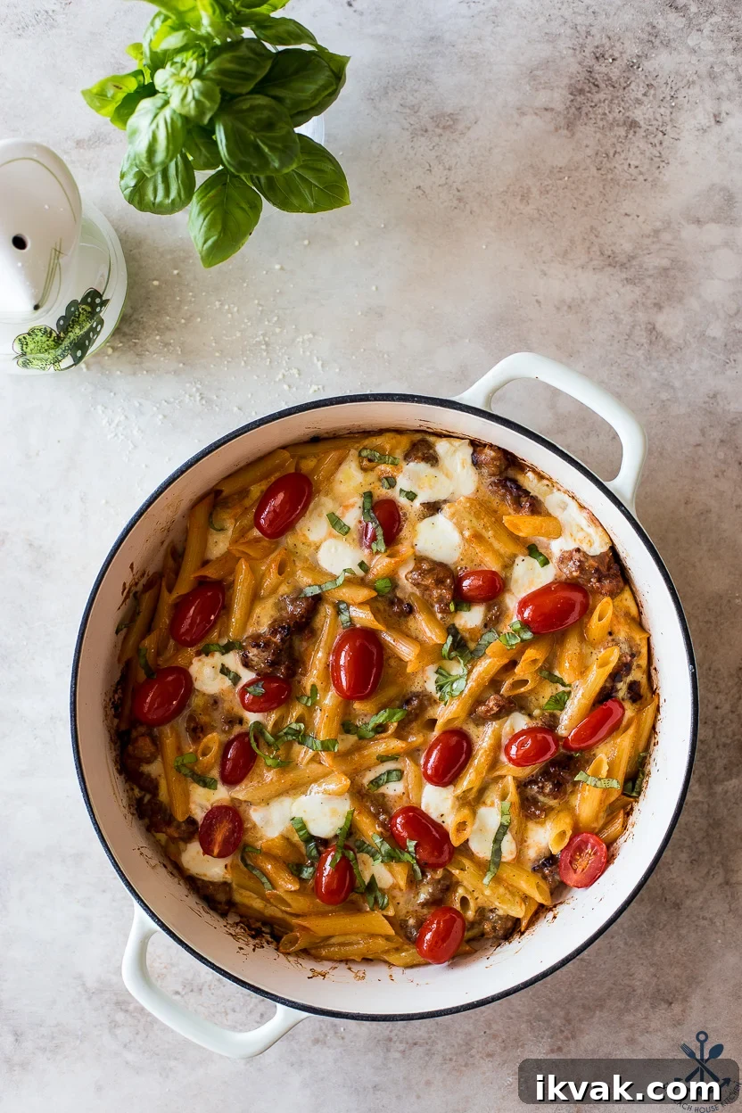 Overhead photo of a round baking dish filled with an Italian sausage pasta frittata