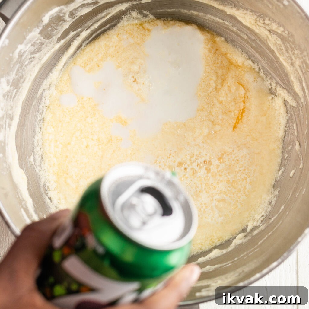 Moist 7-Up Pound Cake | Southern Soul Food Recipe 11 pouring in 7-up soda and buttermilk
