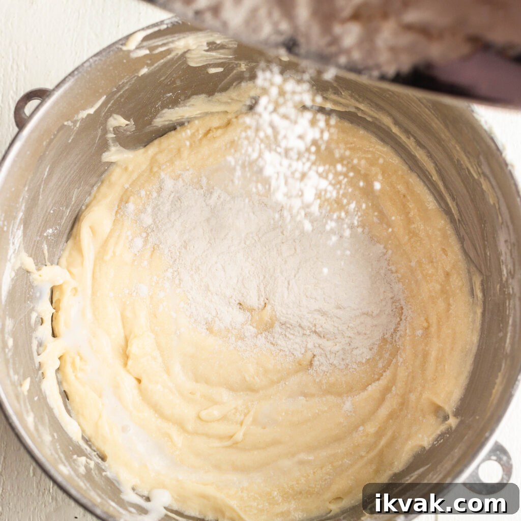 Moist 7-Up Pound Cake | Southern Soul Food Recipe 12 mixing in dry ingredients into batter until incorporated