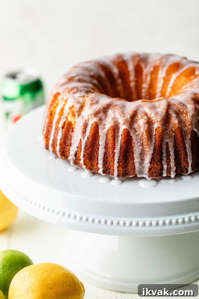 Moist 7-Up Pound Cake | Southern Soul Food Recipe 3 7-up pound cake on white cake stand with lemons and limes