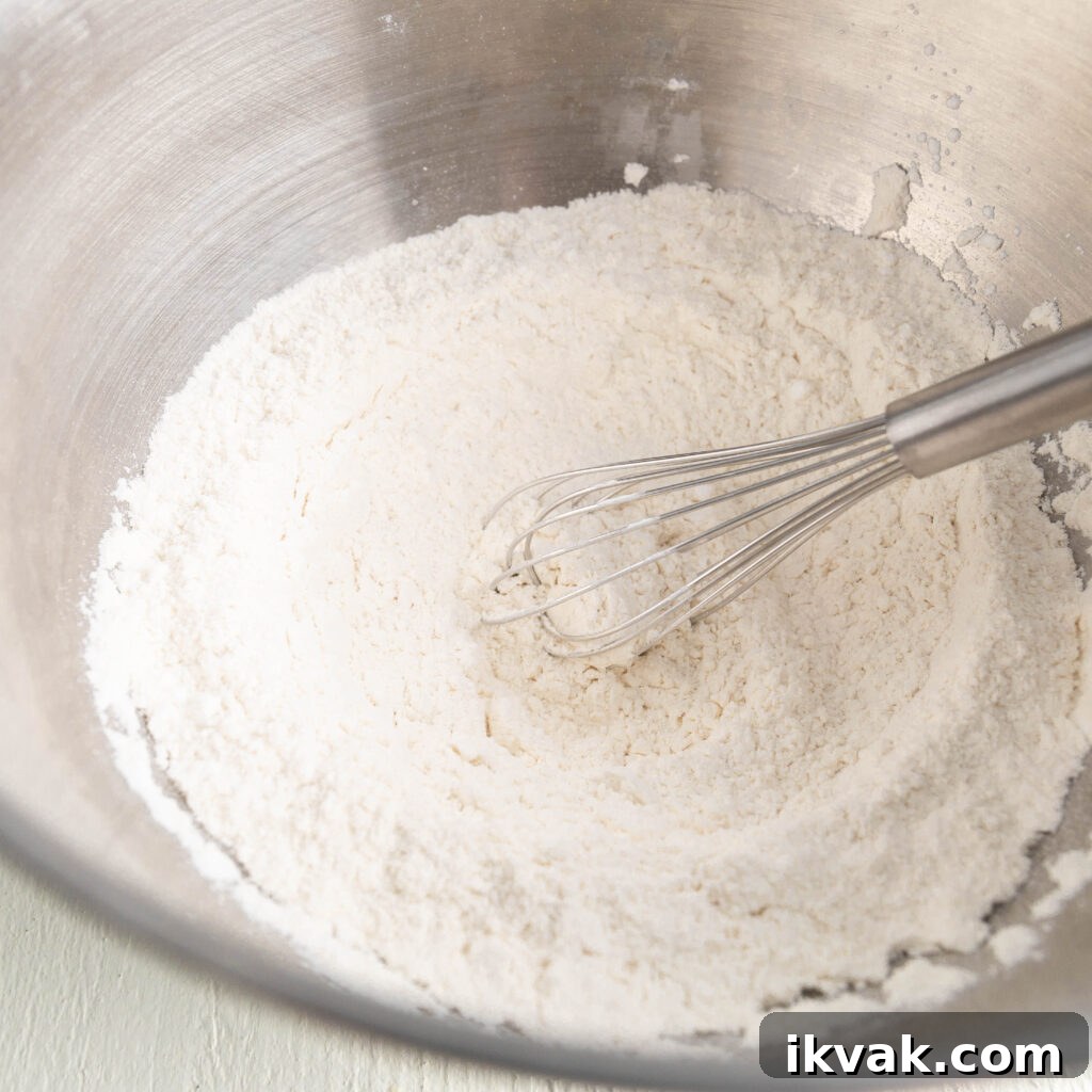 Moist 7-Up Pound Cake | Southern Soul Food Recipe 6 whisking flour, cornstarch, salt, baking powder, and baking soda in a large bowl
