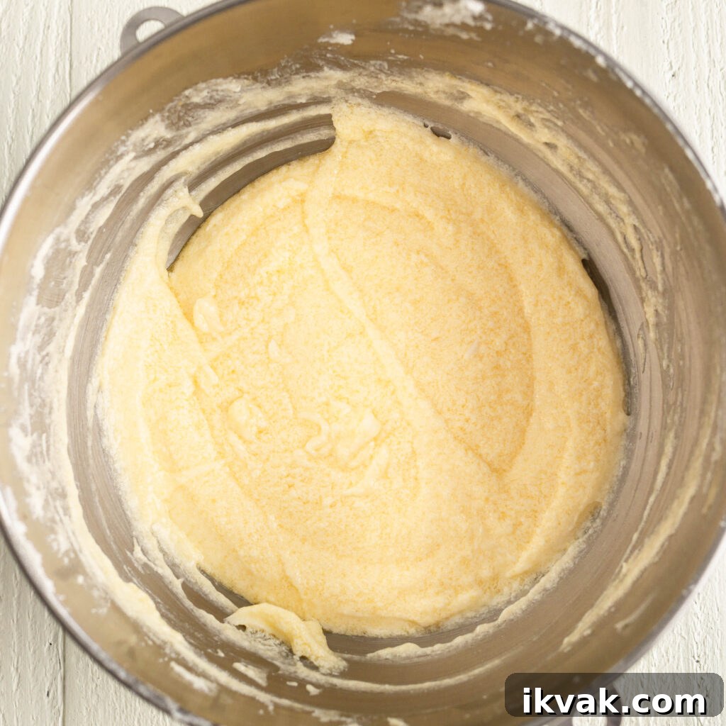 Moist 7-Up Pound Cake | Southern Soul Food Recipe 9 beating eggs into sugar and butter
