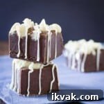 Side view of two pieces of fudge stacked on top of each other.