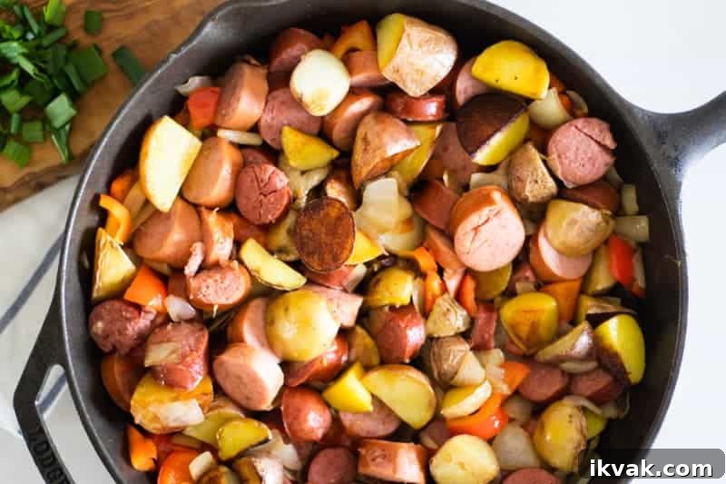 cast iron skillet with potatoes and sausage meal