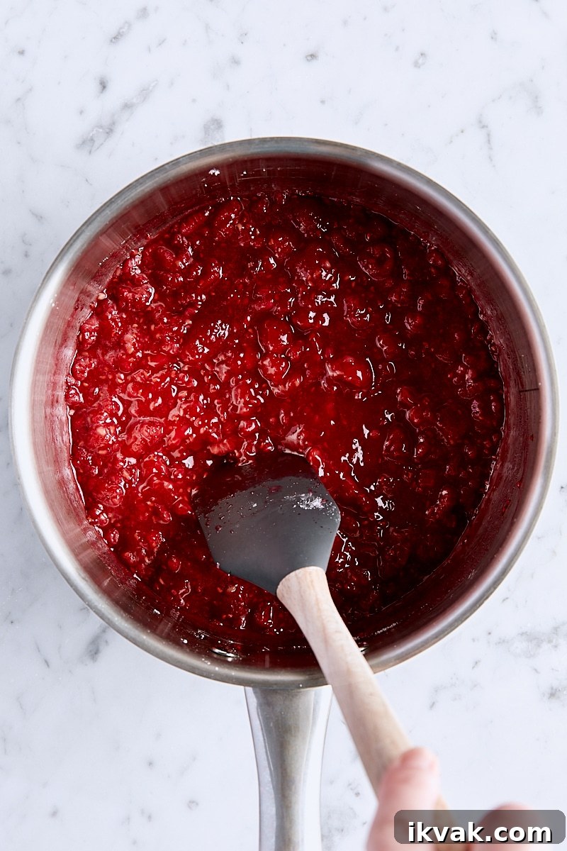Chewy Raspberry Crumble Bars with Oat Crust 13 Raspberry filling brought to a boil in saucepan