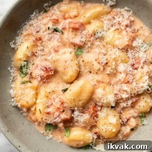 Creamy Tomato Gnocchi Recipe: Quick Weeknight Comfort Meal 7 a bowl of creamy tomato gnocchi with grated parmesan