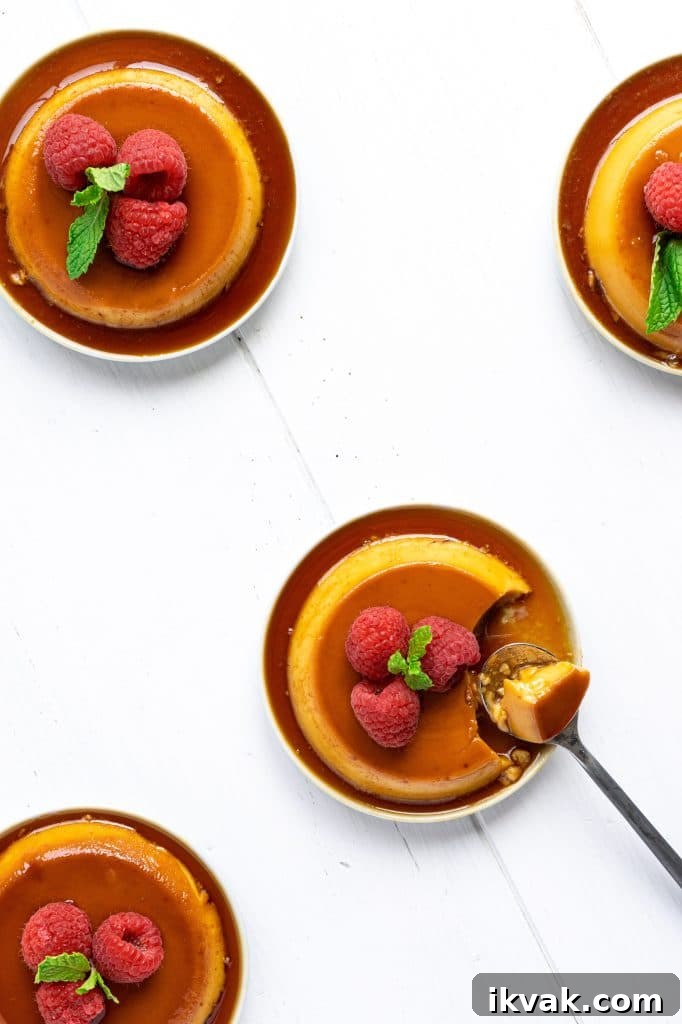 Puerto Rican Salted Coconut Flan on small plates with raspberries.