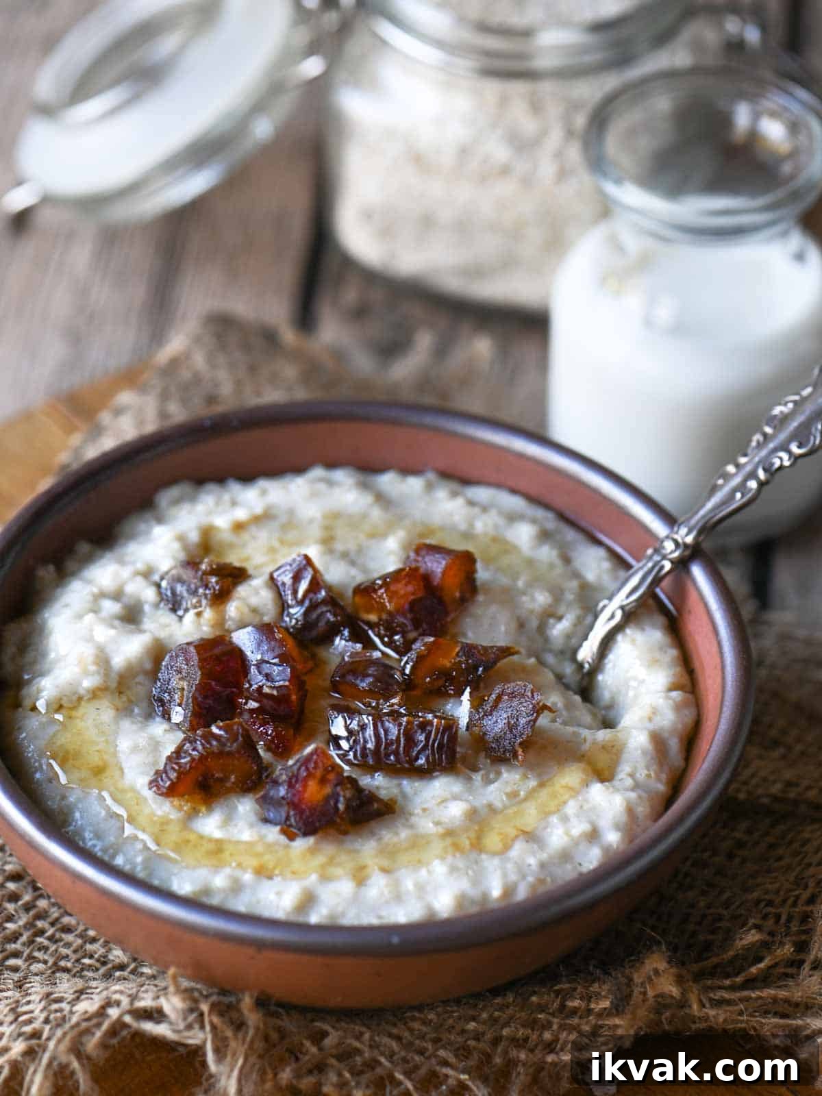 Creamy Scottish Oatmeal with Dates and Honey 2 Oatmeal with dates and honey in a brown bowl.