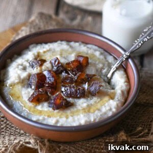 Creamy Scottish Oatmeal with Dates and Honey 9 A bowl of oatmeal with honey and dates with a spoon to the right.