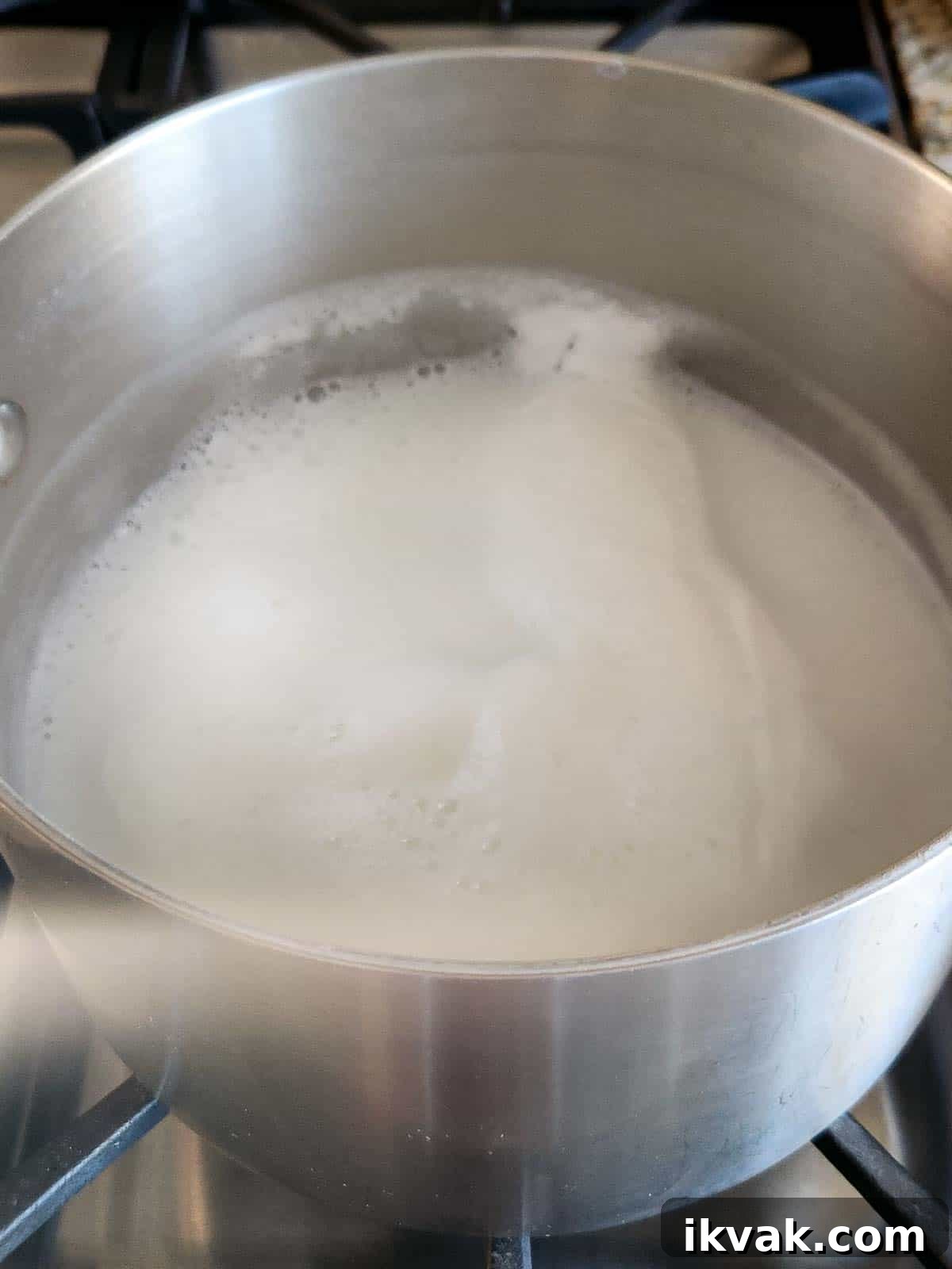 Creamy Scottish Oatmeal with Dates and Honey 4 Boiled milk in a stainless tell pot.
