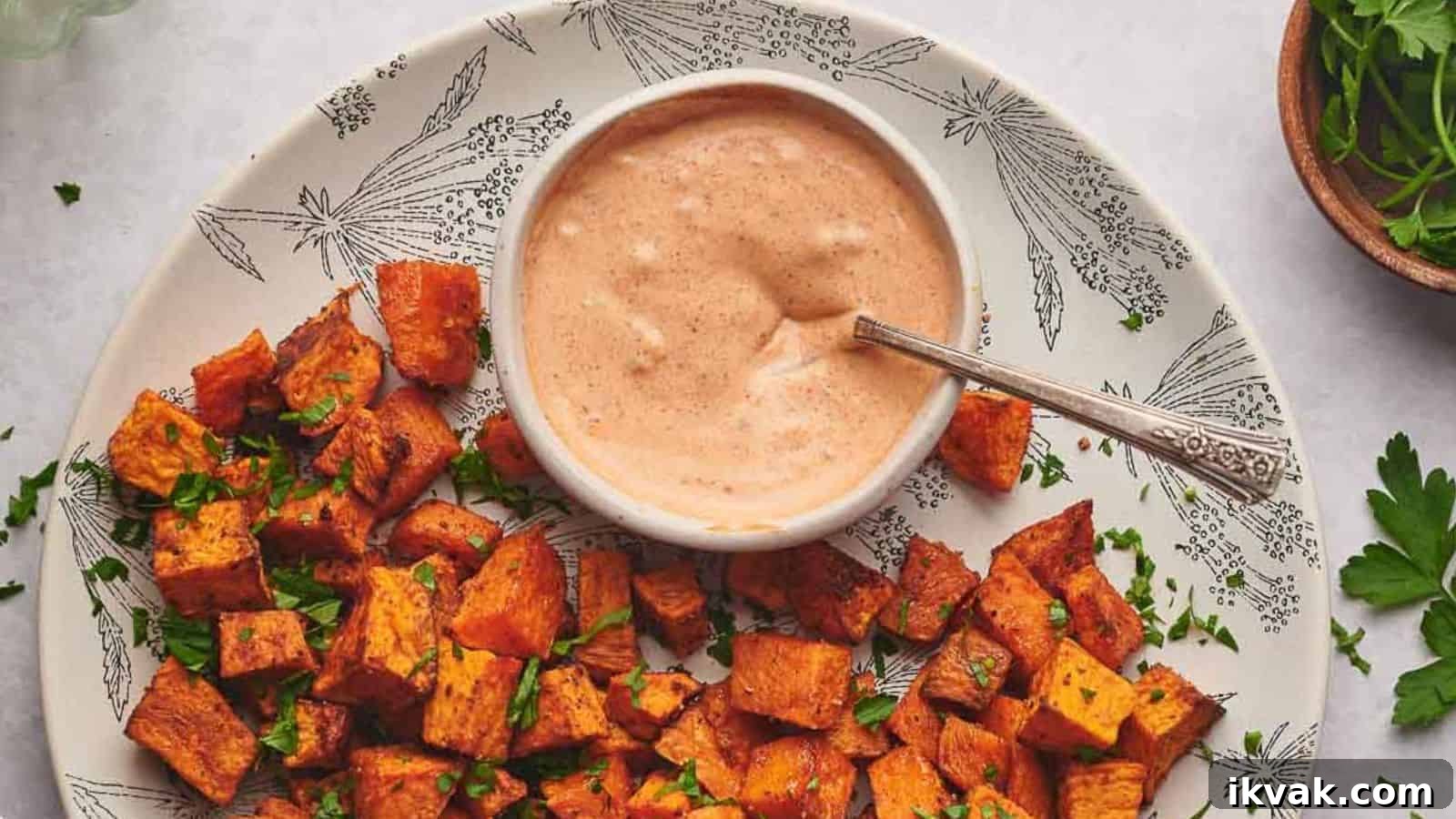25 Creative Ways to Use Dip Recipes Beyond the Bowl 11 Dipping sauce in a small bowl surrounding by sweet potato cubes.