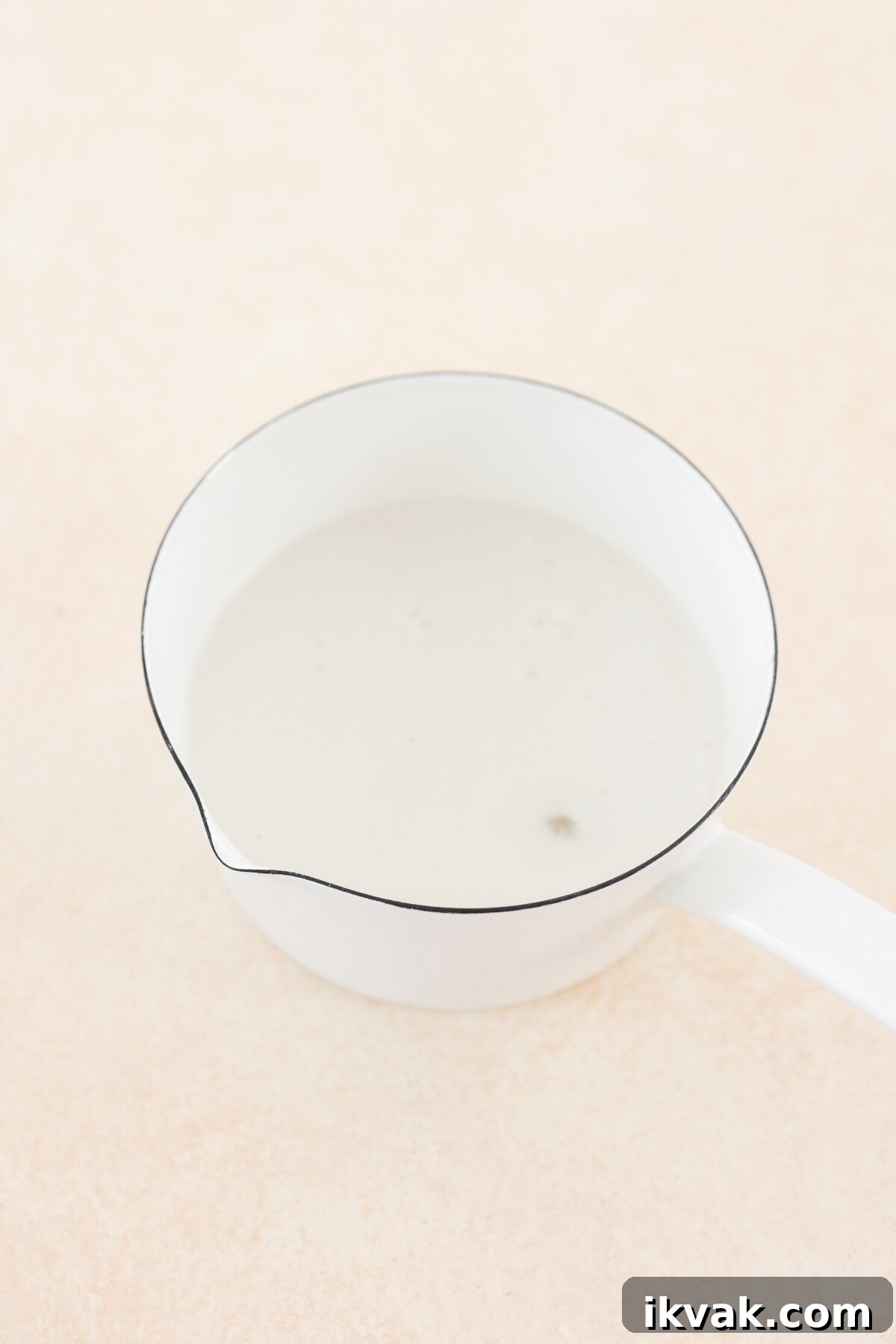 Silky Vegan Passion Fruit Posset Recipe 7 a saucepan filled with ingredients