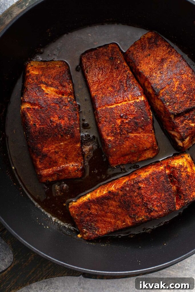Blackened Salmon Recipe: Quick Cajun-Style Pan-Seared Fillets 11 Pan seared Salmon Fillets in a skillet