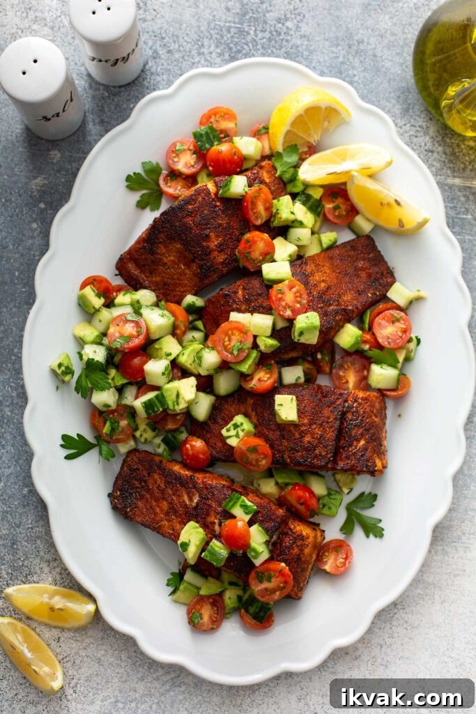 Blackened Salmon Recipe: Quick Cajun-Style Pan-Seared Fillets 3 Pan seared fillets of salmon coated in blackening spices and topped with a fresh chopped salad