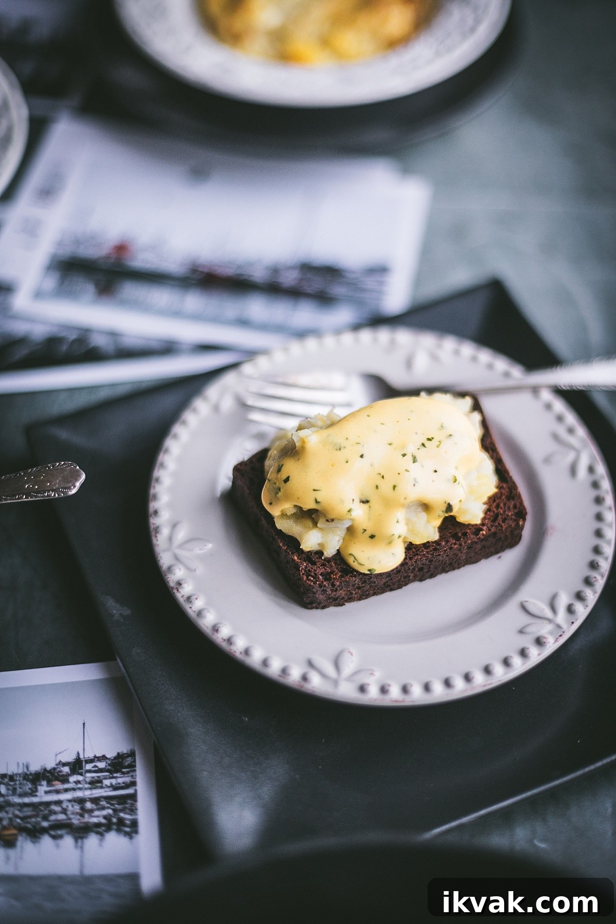 Plokkfiskur: Classic Icelandic Potato and Fish Stew 9 piece of Rúgbrauð – Icelandic Rye bread covered with hearty serving of plokkfiskur smothered in golden creamy bearnaise sauce
