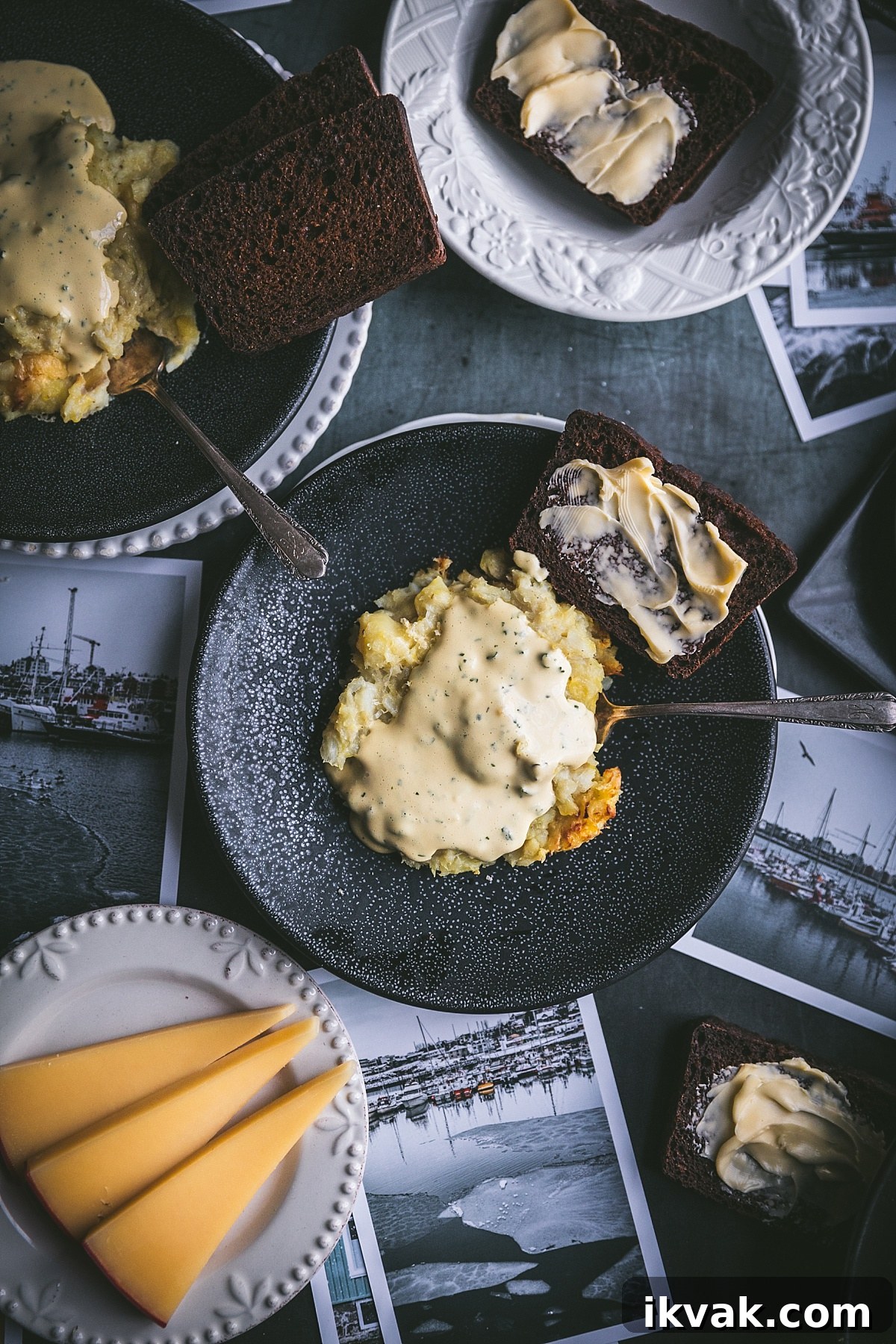 Plokkfiskur: Classic Icelandic Potato and Fish Stew 10 overhead shot of plates of icelandic fish stew with Rúgbrauð – Icelandic Rye bread. styled with images of iceland, mild cheese, more slices of bread, mild cheese