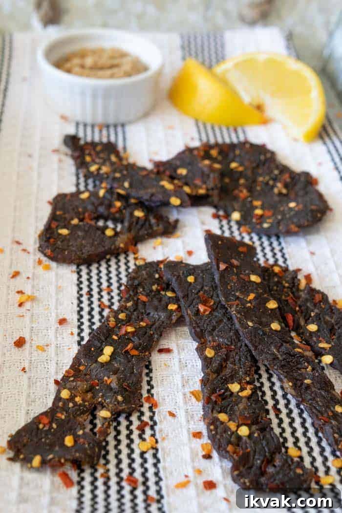 Spicy Sweet beef jerky finished on a towel with lemons and brown sugar
