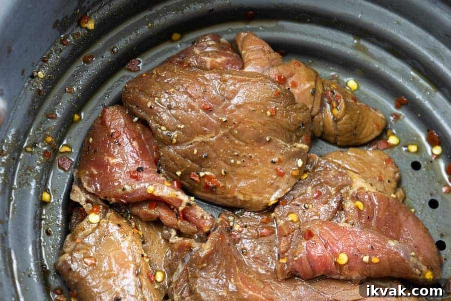 Spicy Sweet Beef Jerky strained in colander
