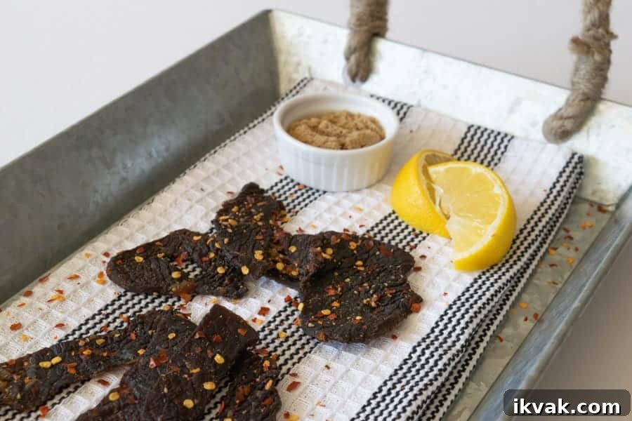 Simply Sweet Beef Jerky on tray with lemons and brown sugar