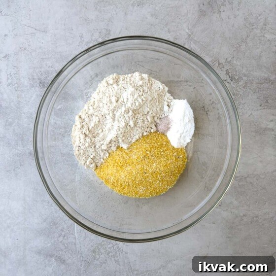 Dry ingredients for the cake in a glass bowl.
