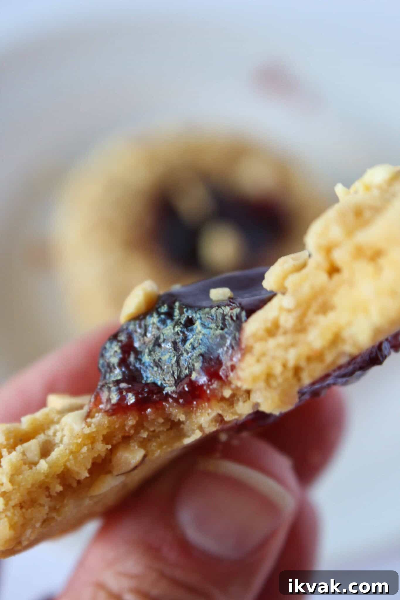 Peanut Butter and Jelly Cake-Mix Cookies 2 PB & J Cookie with a bite taken from it.