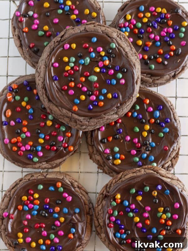 Seven Cosmic Brownie Cookies on a cooling rack.