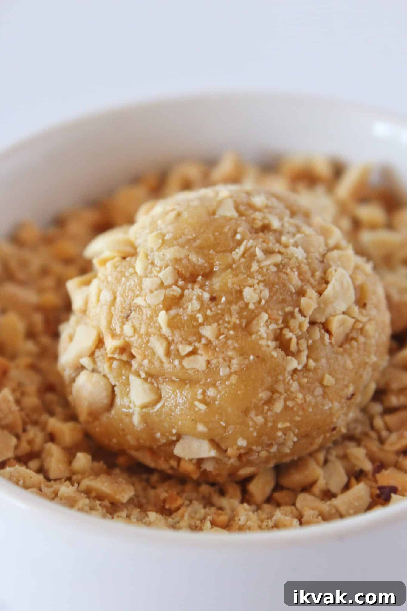 Peanut Butter and Jelly Cake-Mix Cookies 6 Rolling peanut butter cookies in chopped peanuts.
